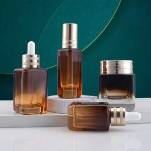 Premium amber square glass bottle set including pump bottle, dropper bottle & cream jar. Perfect for luxury skincare sets & serums. Features UV protection, thick glass, & custom logo printing. Request custom samples & bulk quotes for your brand.